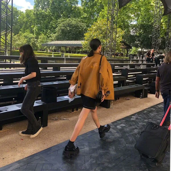 A Woman With A Platform And A Single Shoe - Image 2